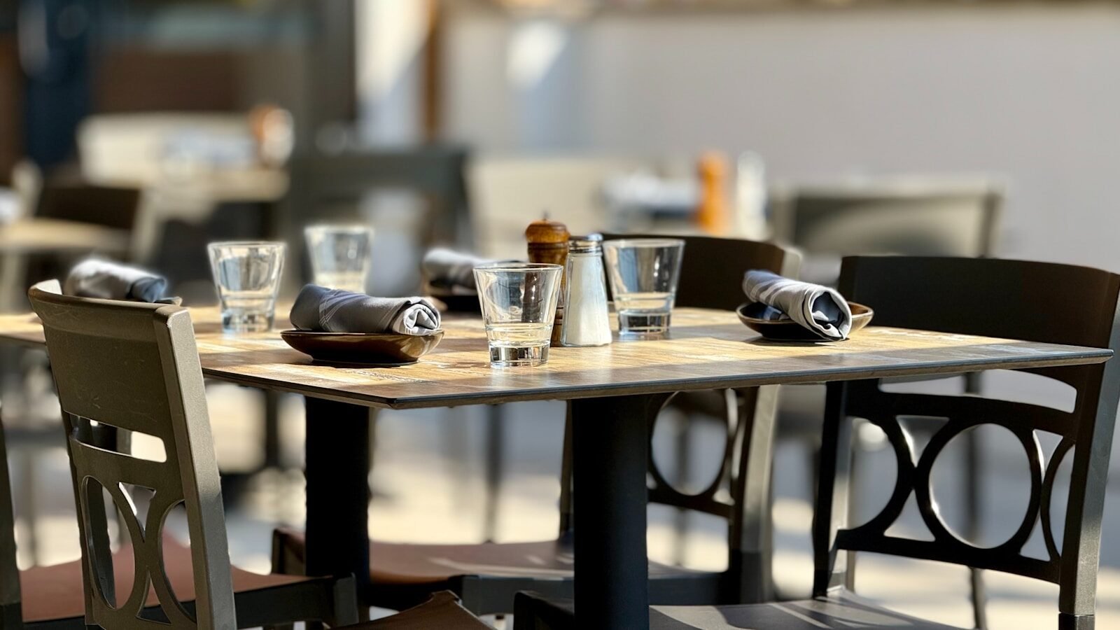 A couple of people sitting at a table with drinks
